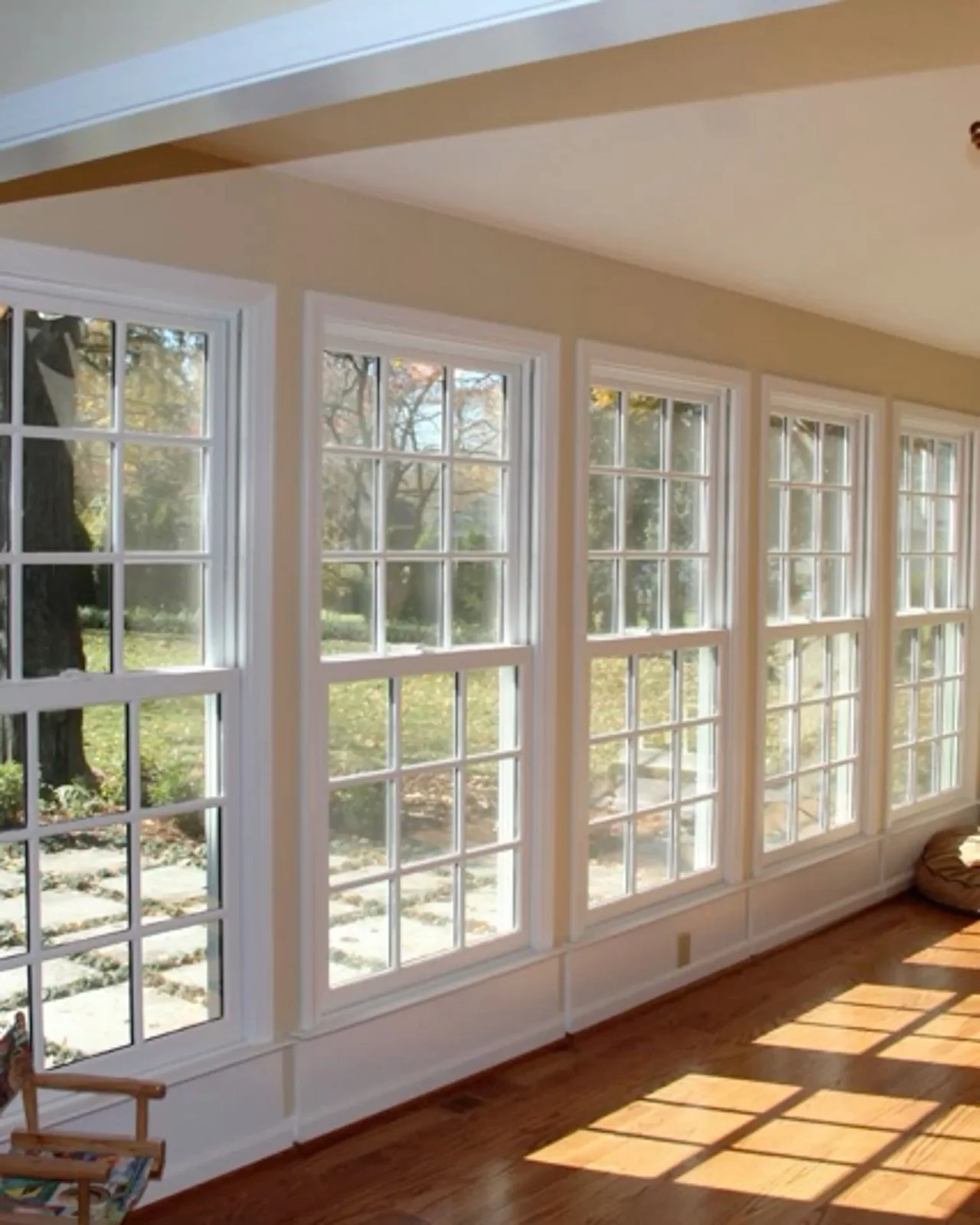 Soft daylight falling into a bright room with tall windows